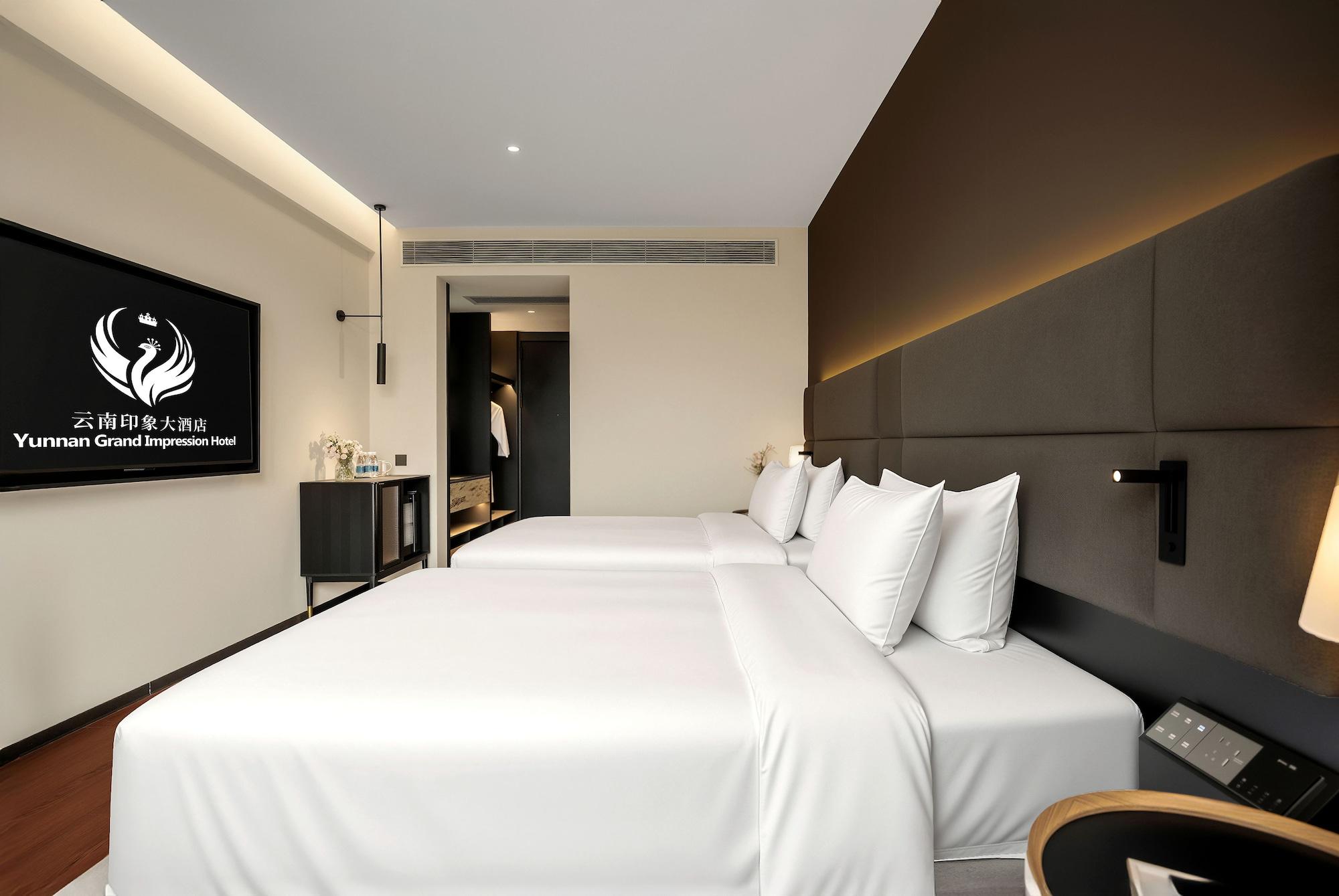 Quarto Yunnan Grand lmpression Hotel