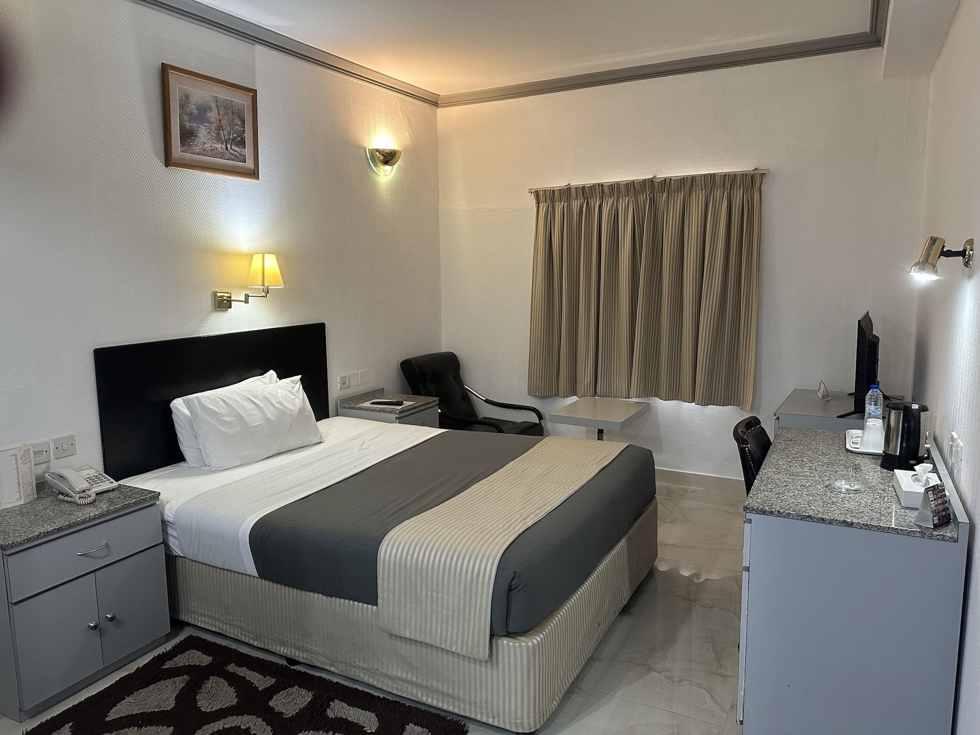 Habitación Grand Astoria Hotel