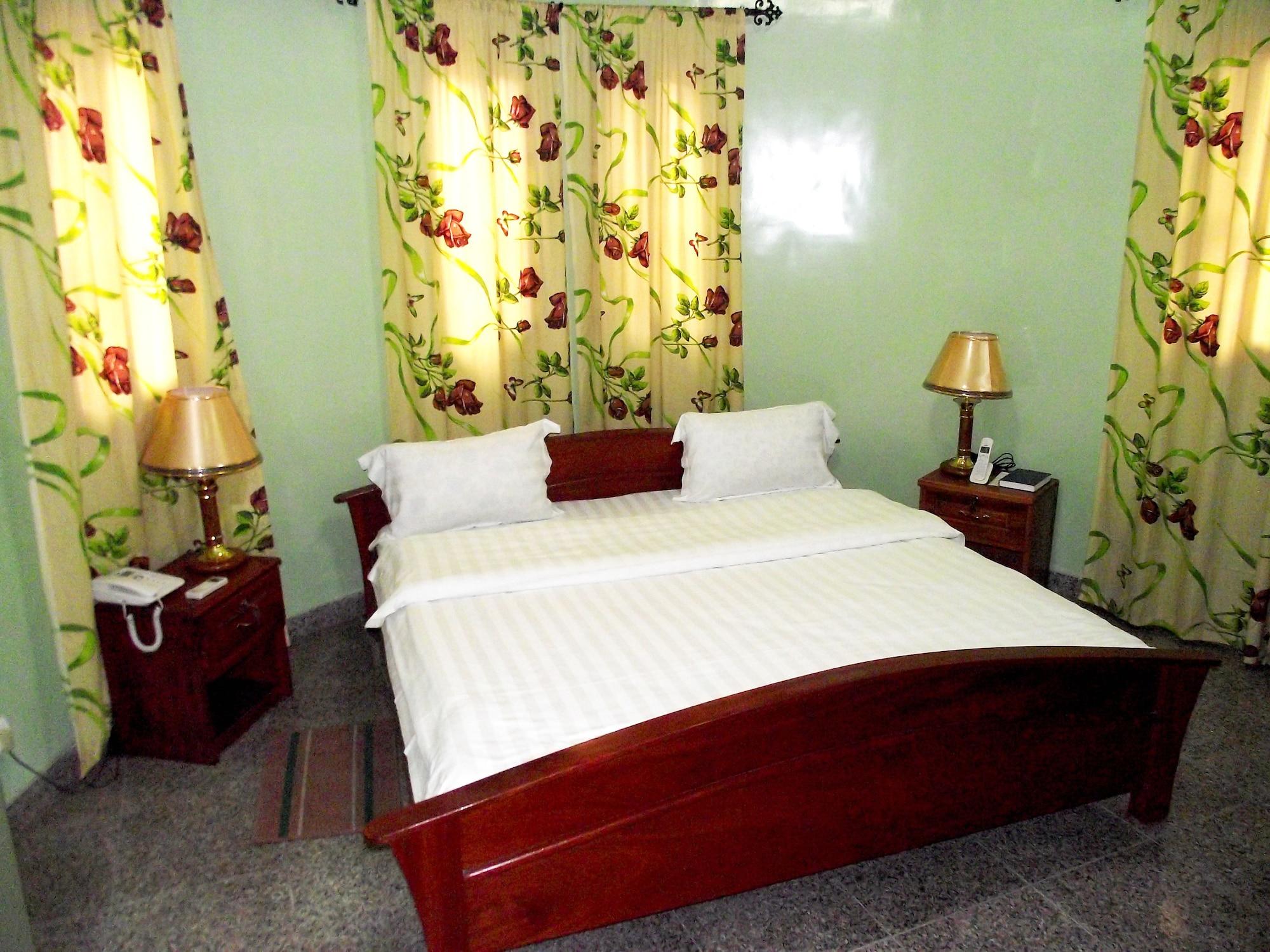 Habitación Hotel Magnificat Baguida