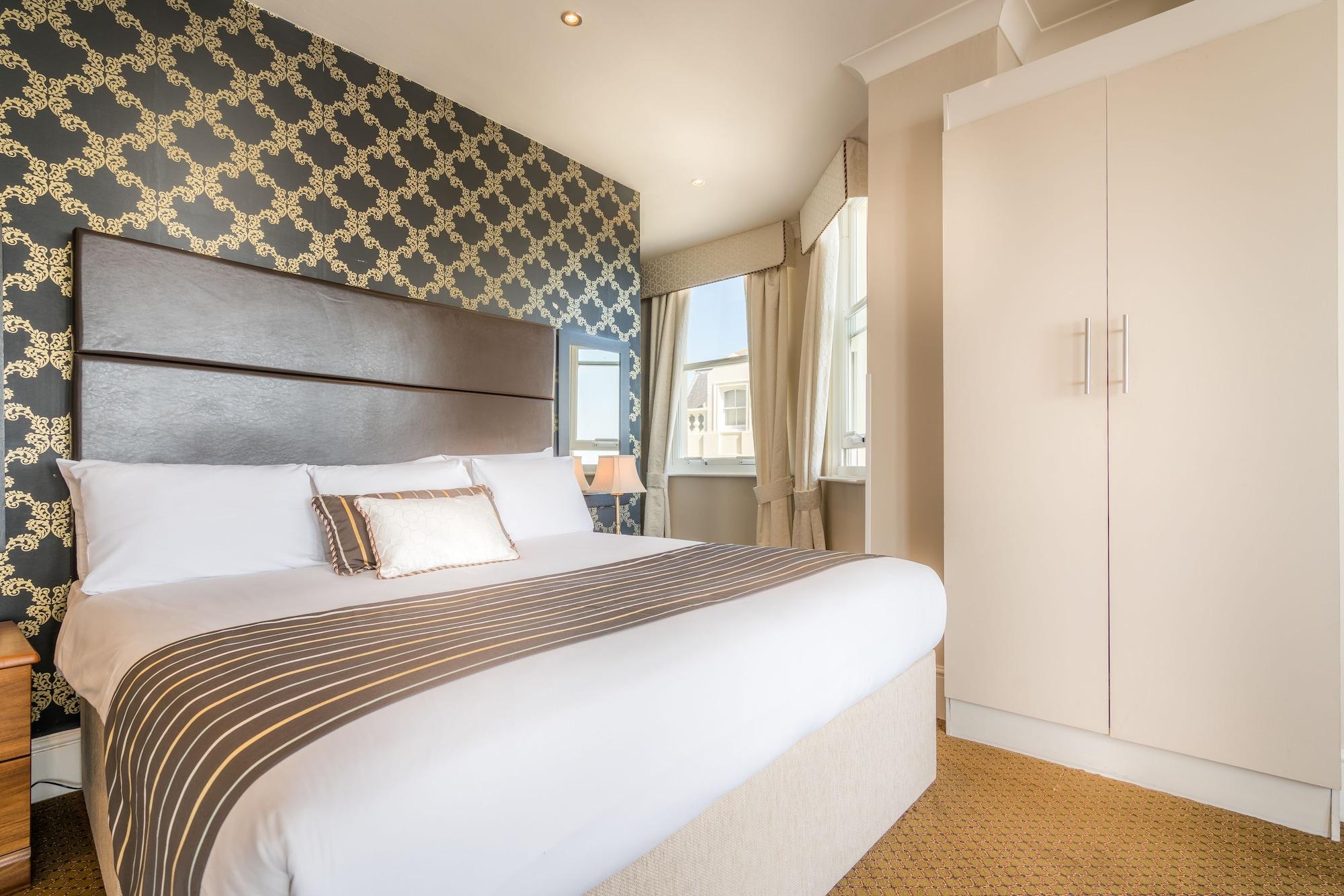 Habitación Queens Hotel
