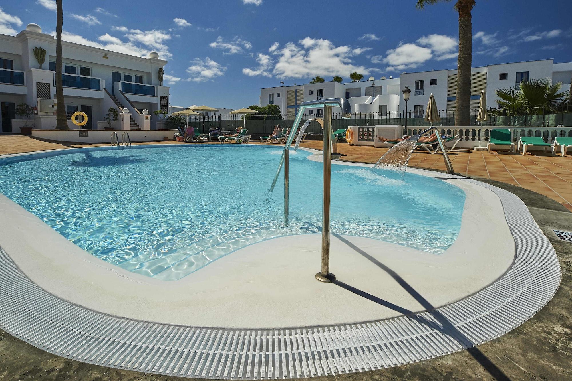 Vista Piscina Montana Club Suite Hotel