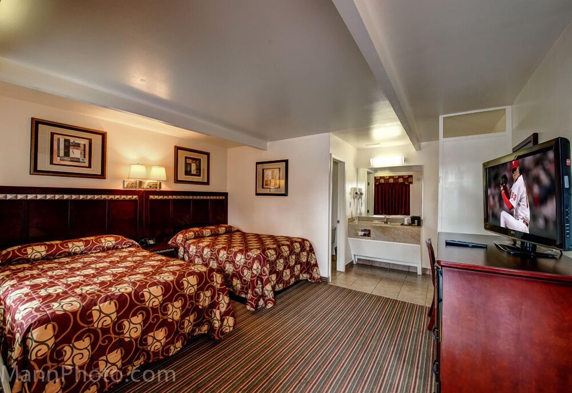 Habitación Whispering Palms Inn