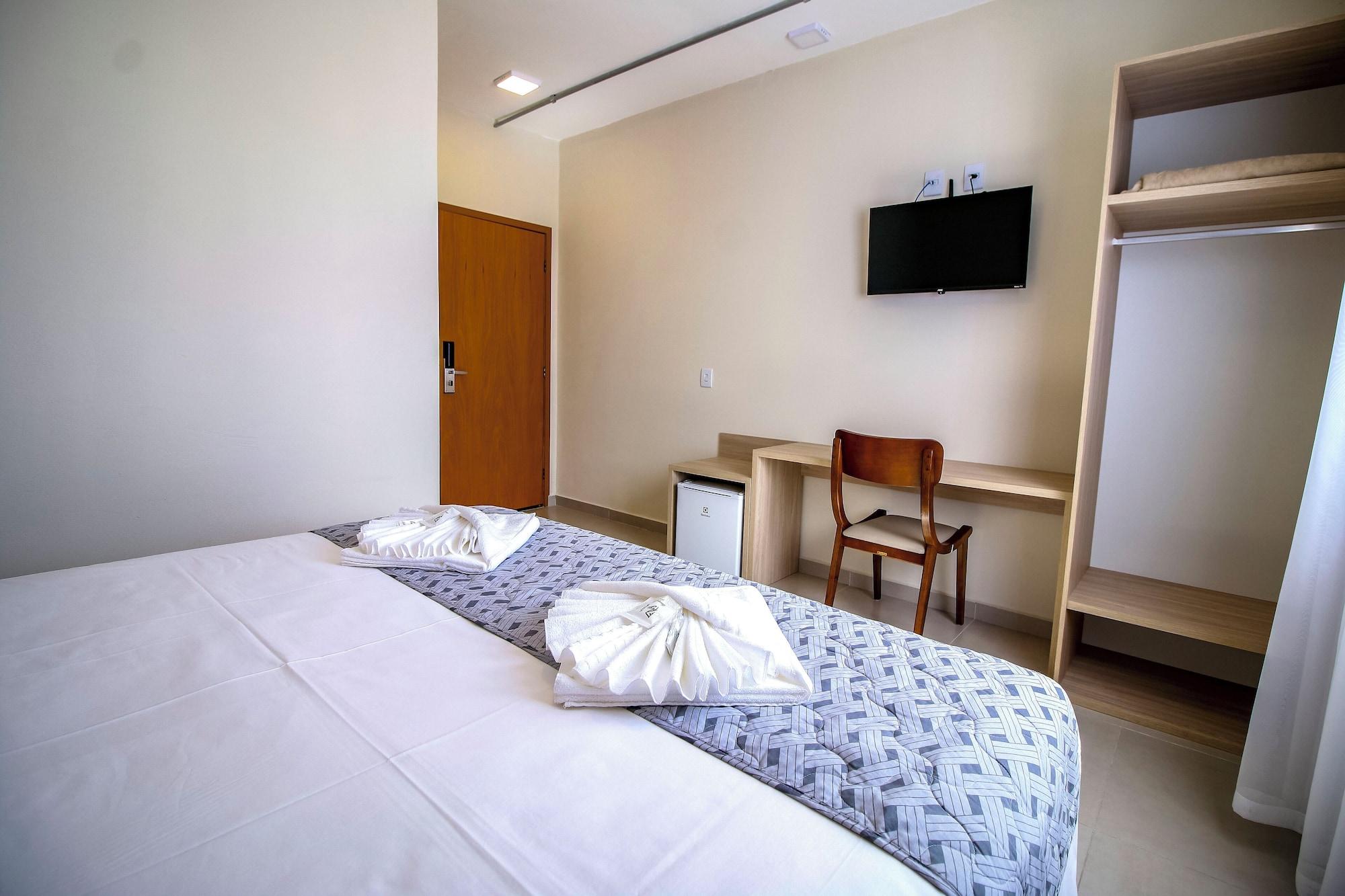 Habitación MLG HOTEL