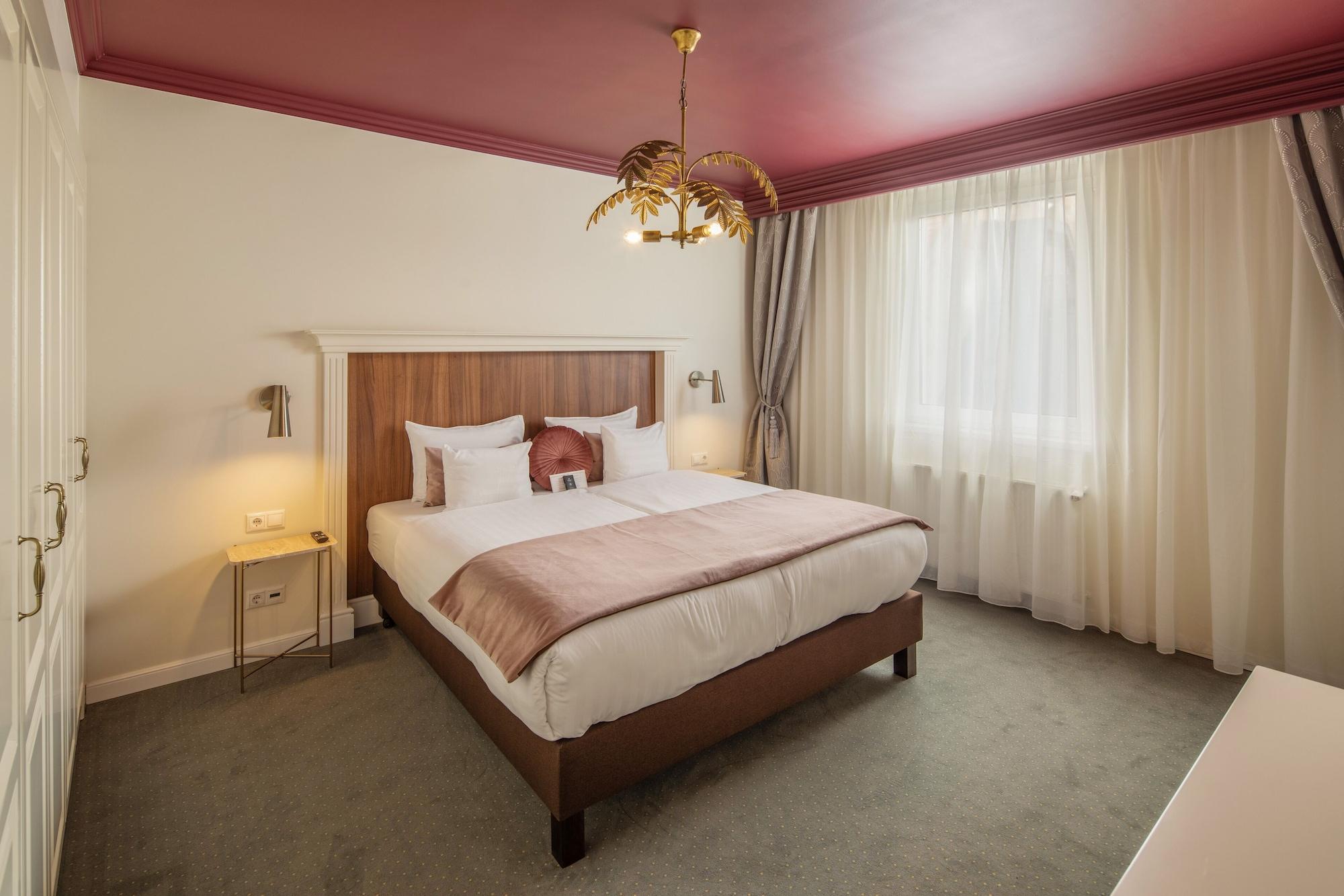 Habitación Queen's Court Hotel & Residence