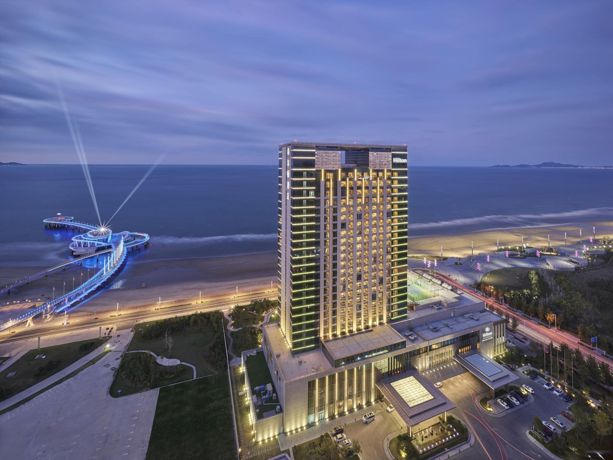 Vista Exterior Hilton Yantai Golden Coast