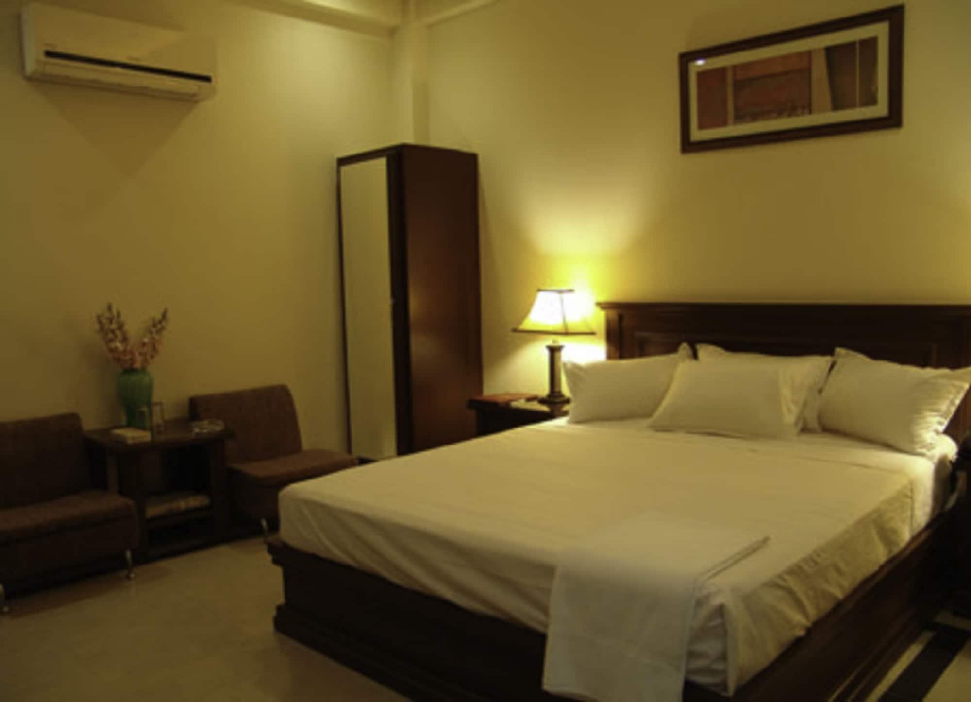 Habitación Raj One Hotel