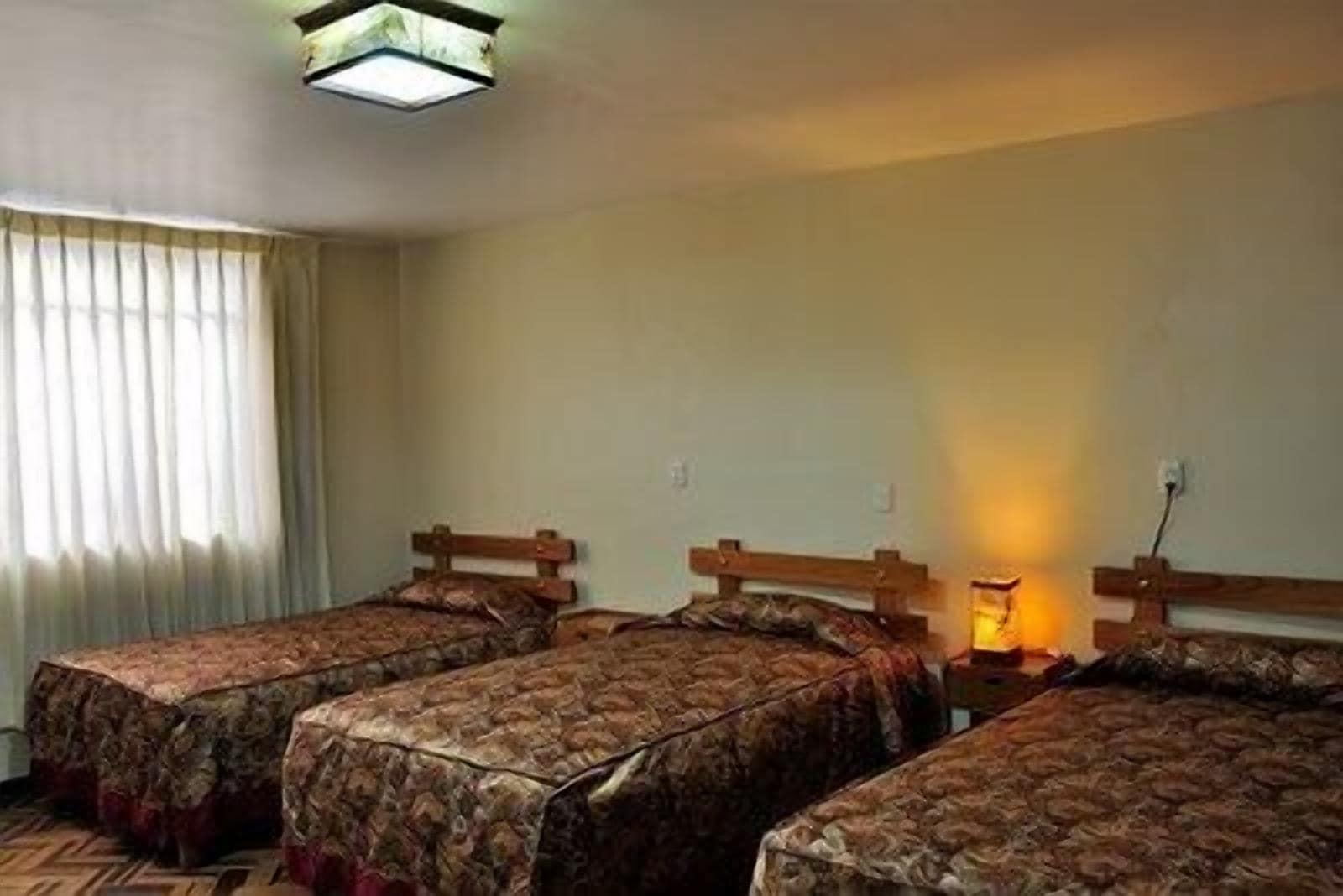 Habitación HOSTAL LOS UROS
