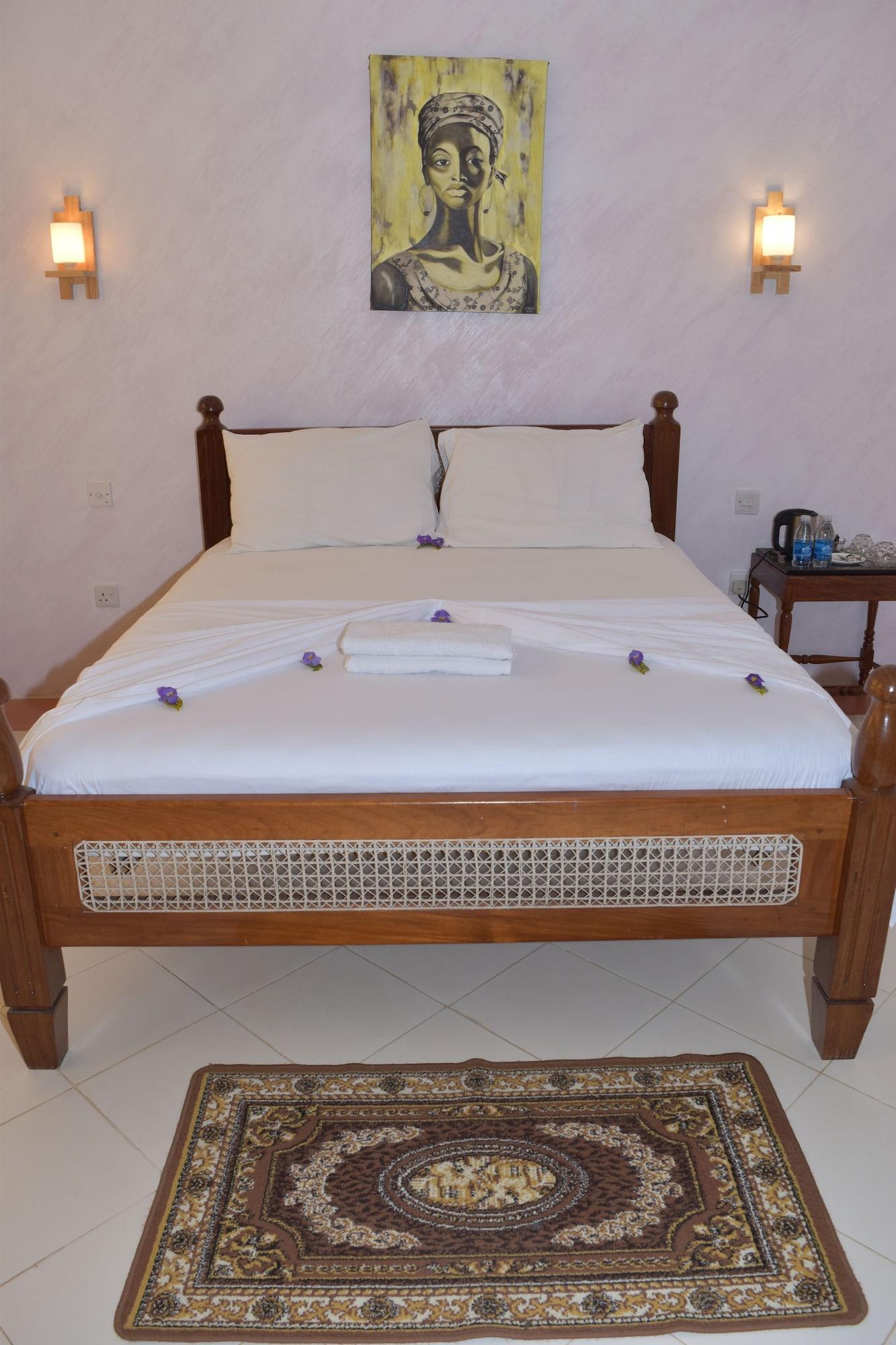 Habitación Chukwani Executive Inn