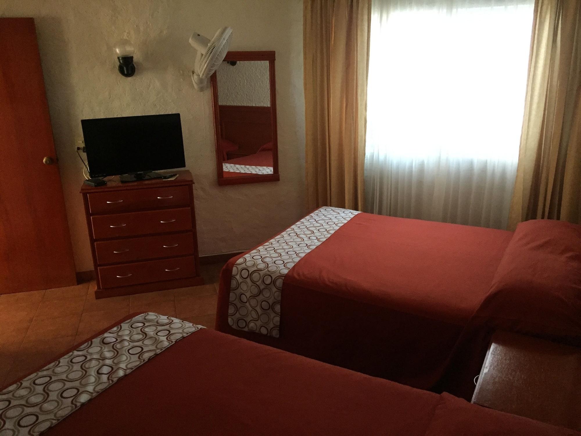 Habitación Hotel & Suites Villa del Sol