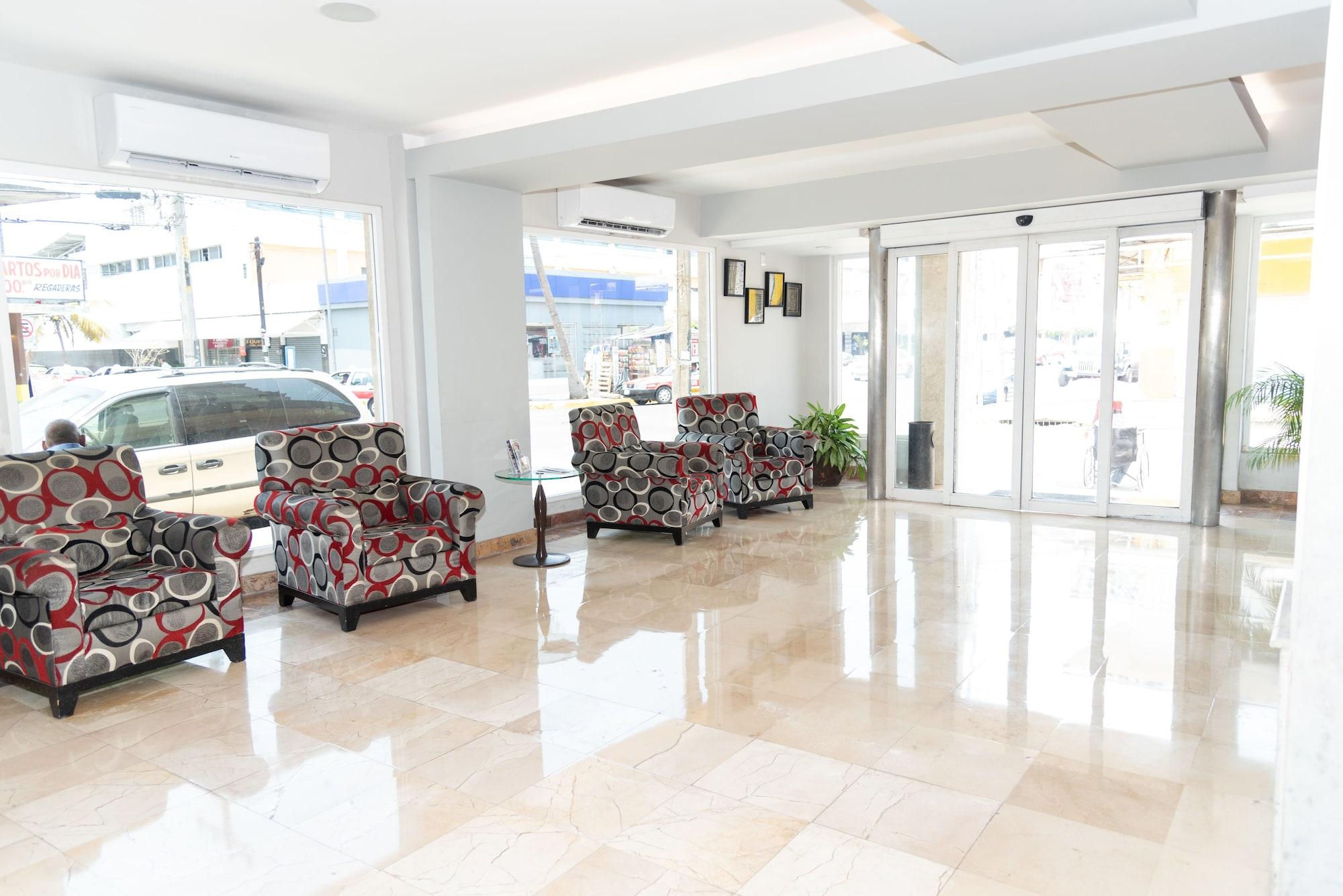 Varios Impala Hotel in front of the ADO