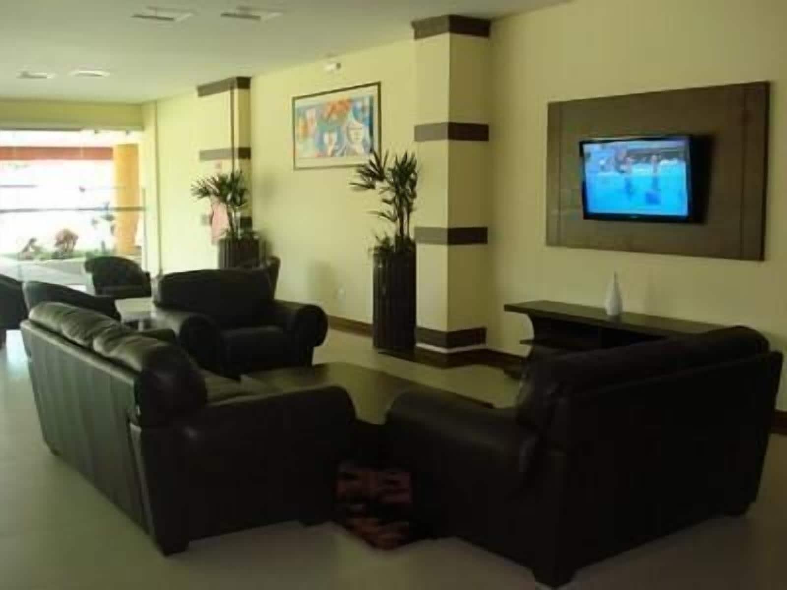 Vista do lobby Flamboyant Suite Hotel