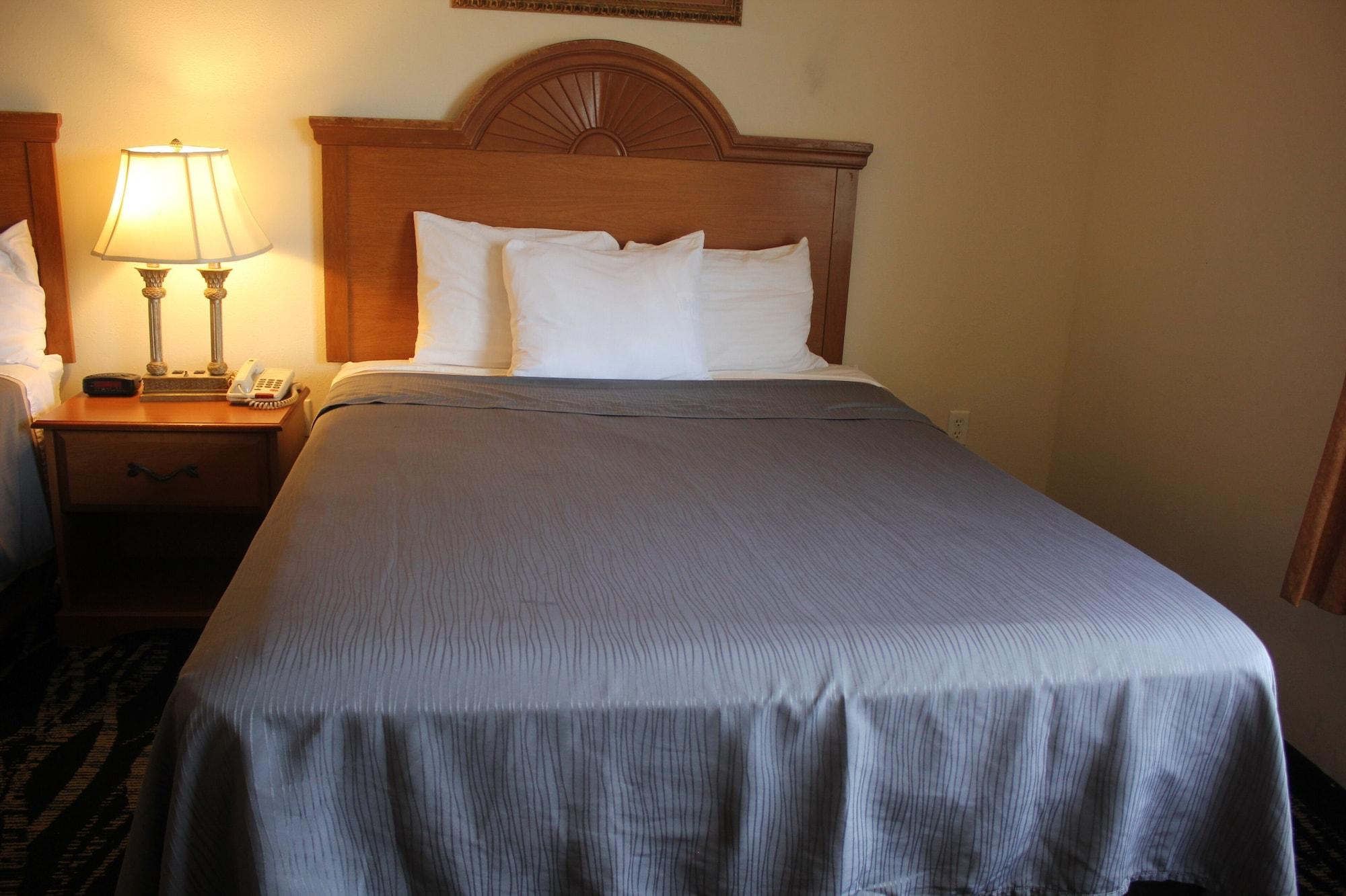 Habitación Heritage Inn & Suites