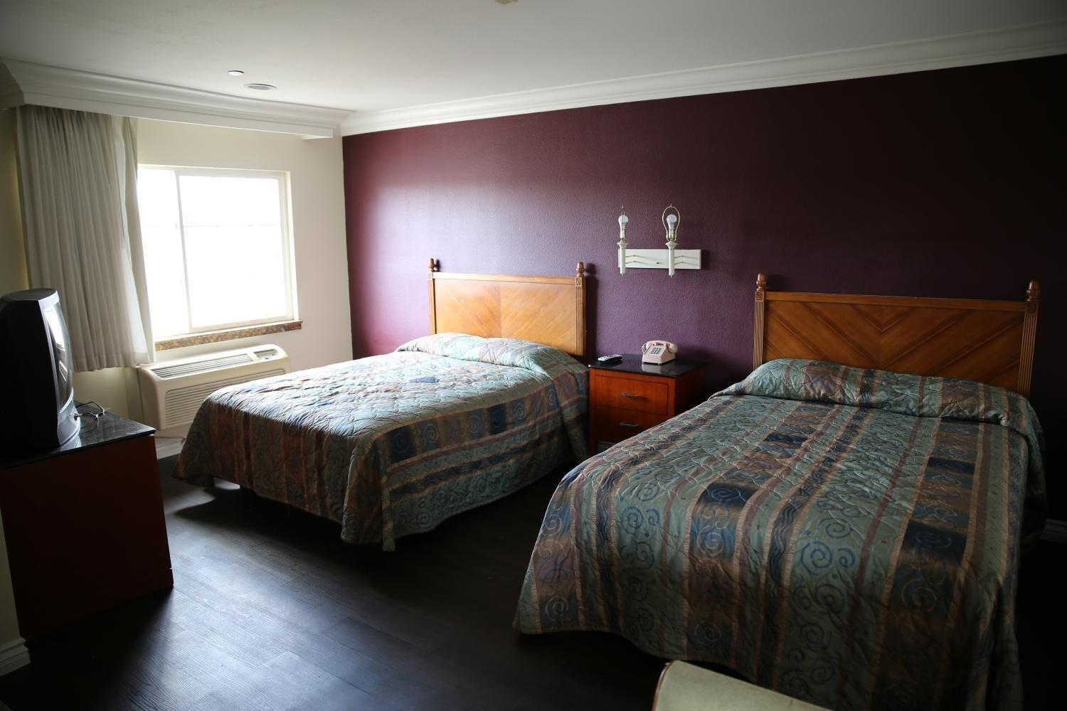 Habitación Chateau Inn and Suites