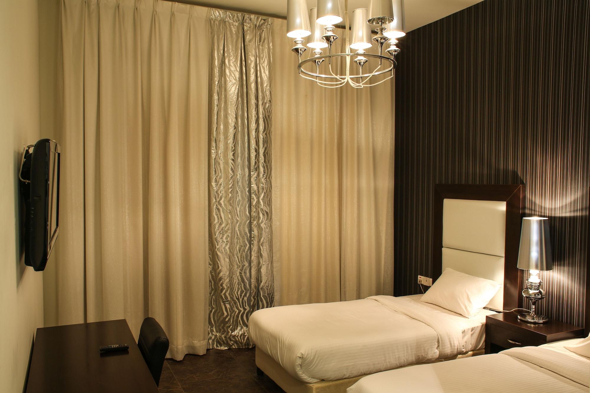 Habitación Loumage Hotel & Suites