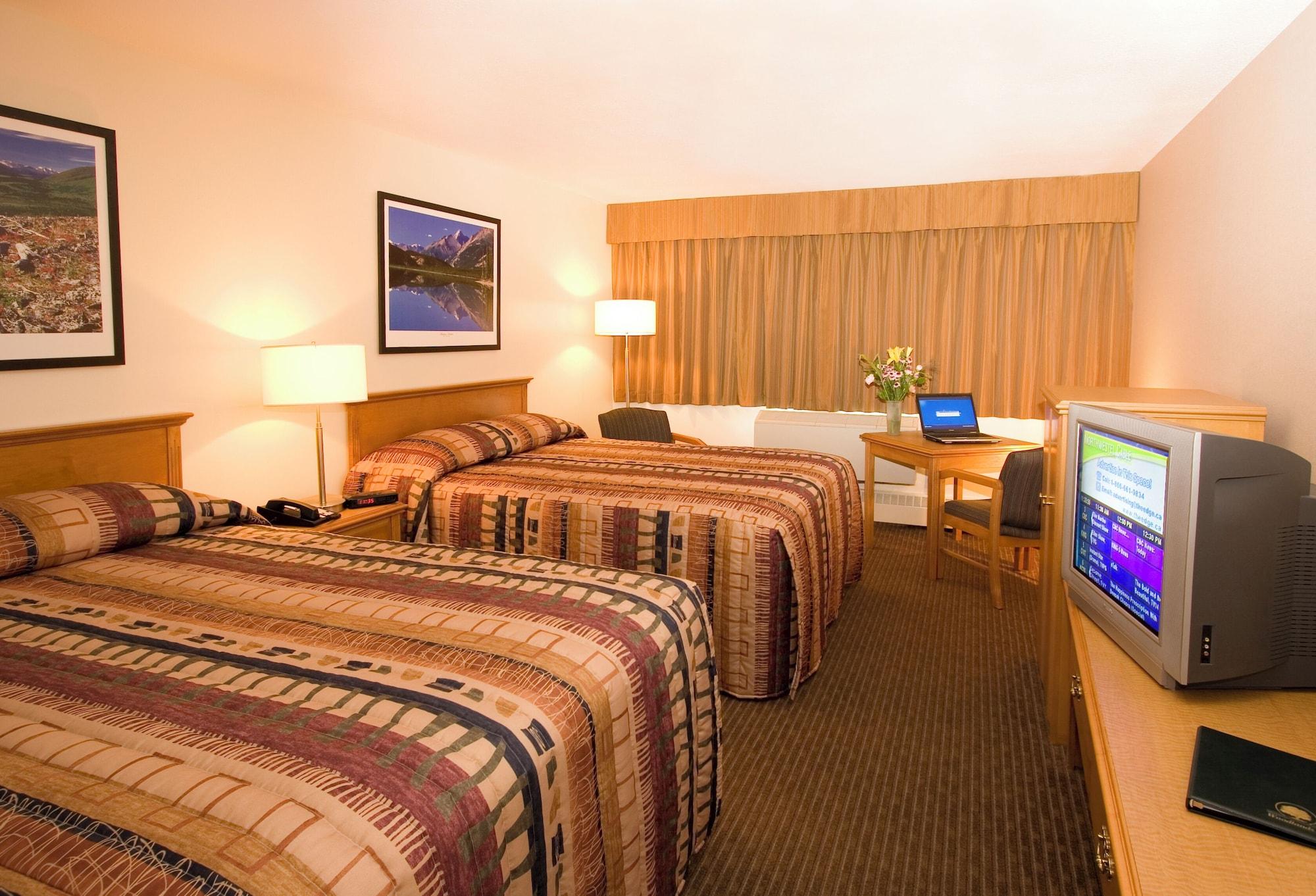 Habitación Woodlands Inn & Suites