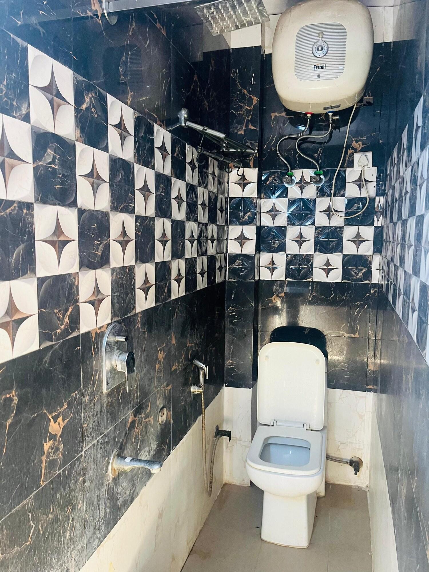 Comodidades do quarto Malviya inn