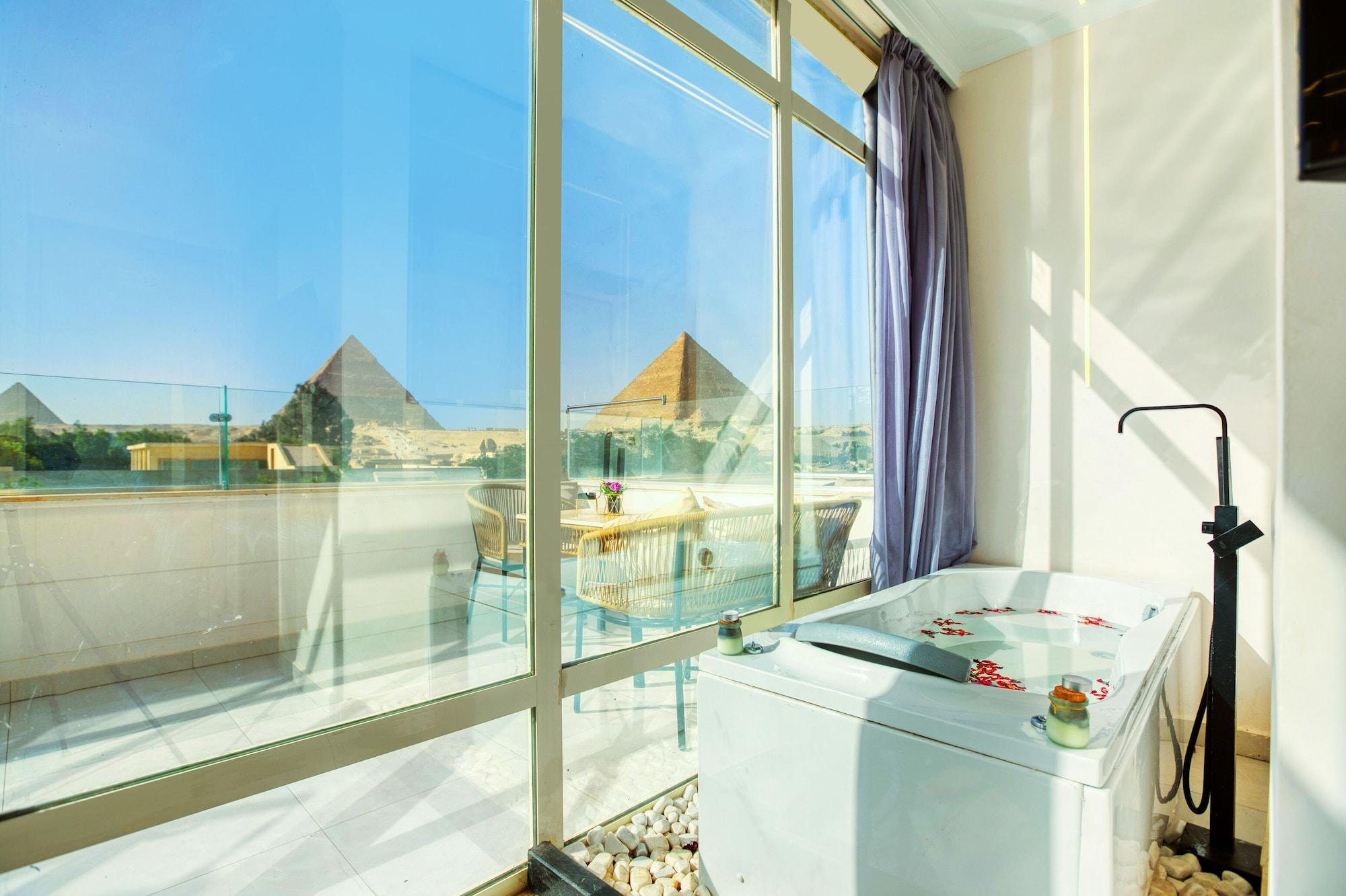 Vista Exterior Tree Lounge Pyramids View INN, Sphinx Giza.