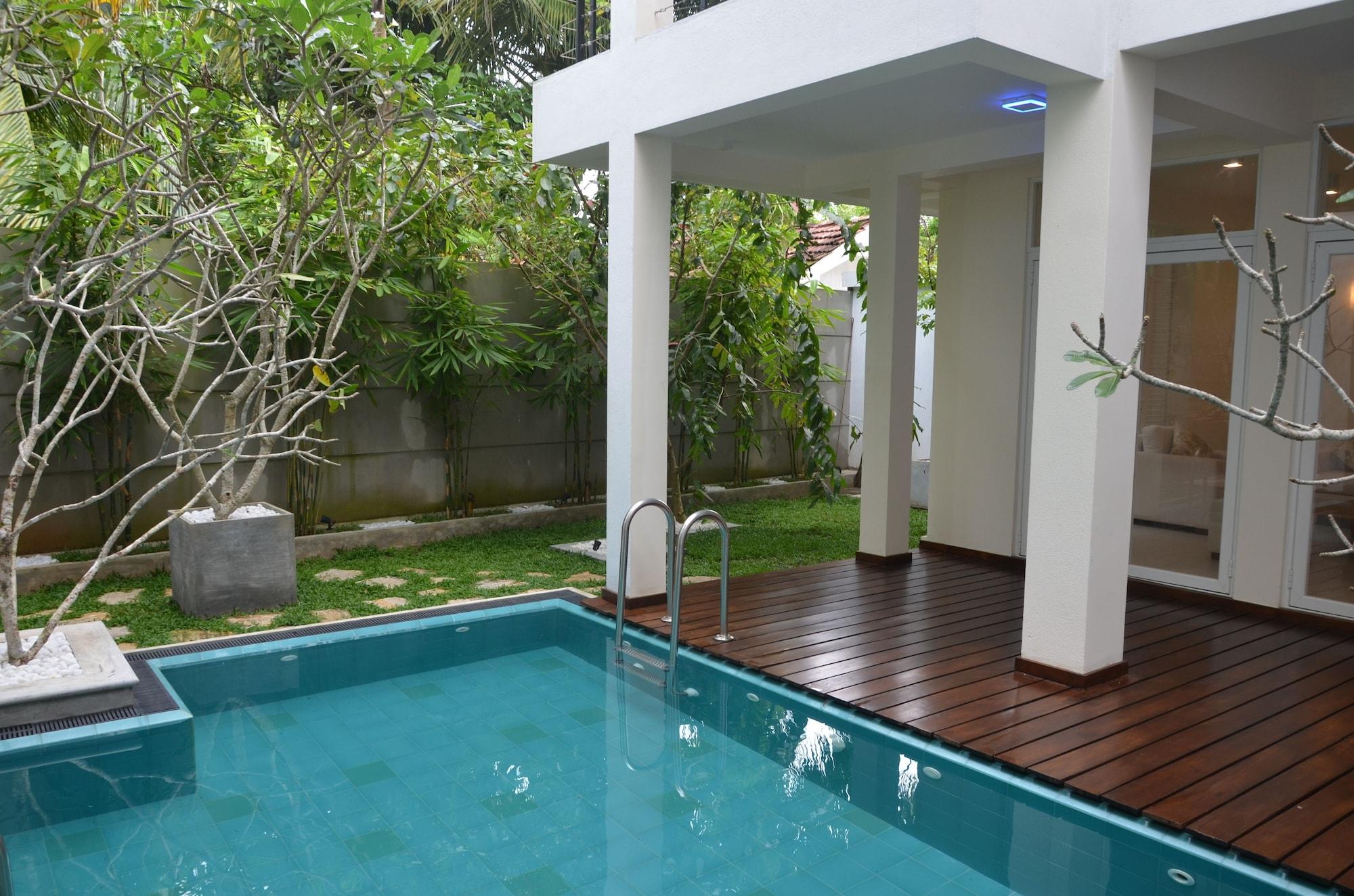 Vista Piscina Anchorage Villa