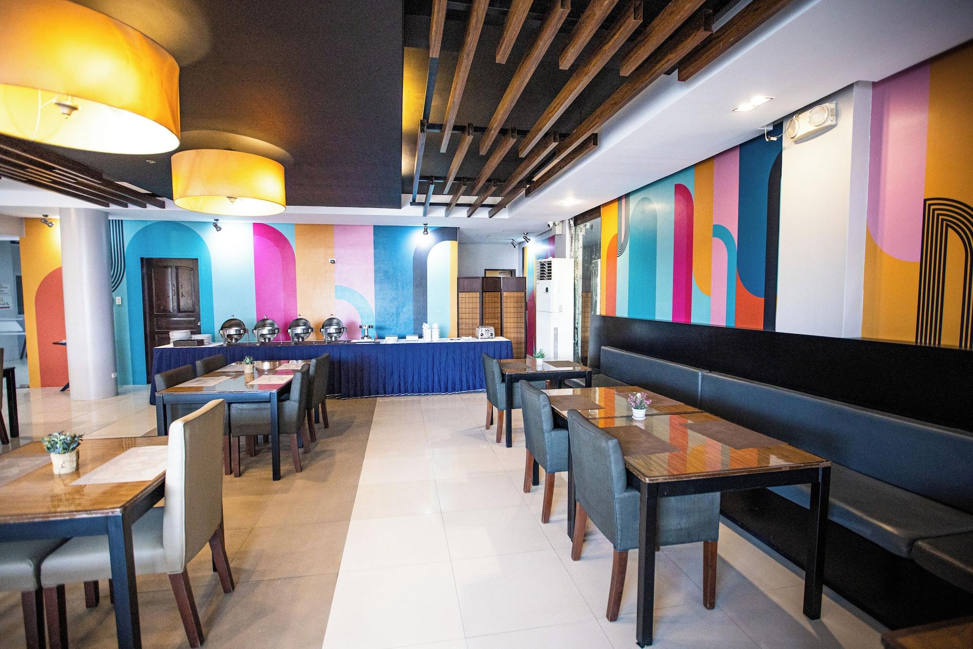 Restaurant Holiday Suites Business District (Empire Suites Hotel)
