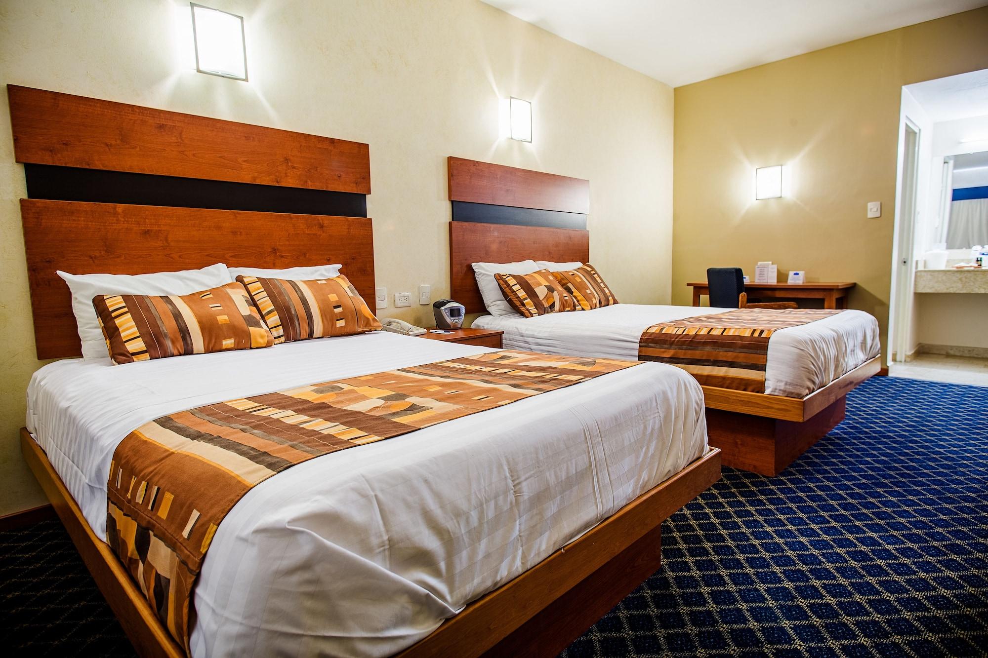 Habitación American Inn Hotel & Suites Delicias