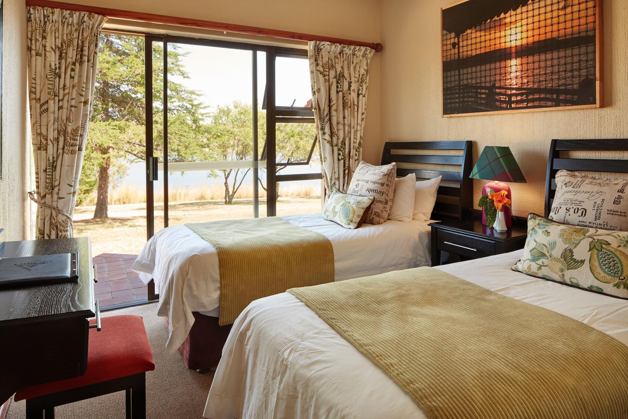 Habitación First Group Qwantani