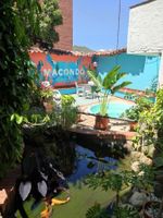 Alojamiento - Macondo Hostel