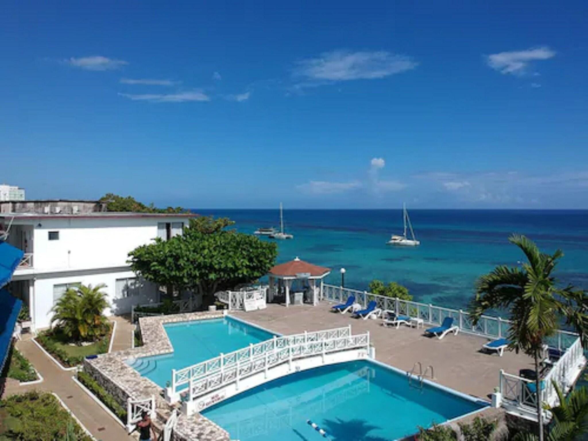 Vista Piscina Hibiscus Lodge