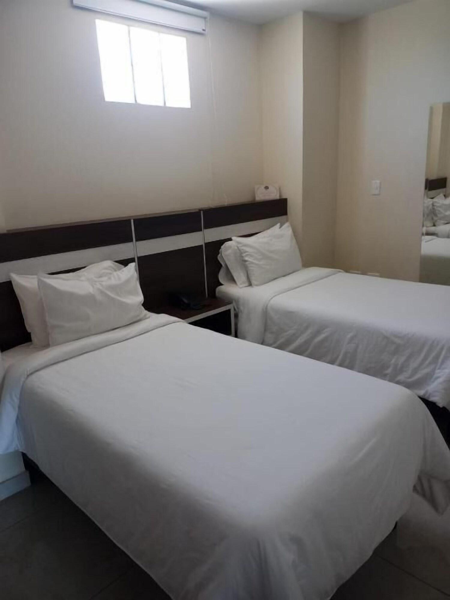 Habitación hotel metropolitano plaza