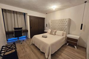 Alquiler Vacacional - Casa Olivo with double height living room, surrounded by a large garden.