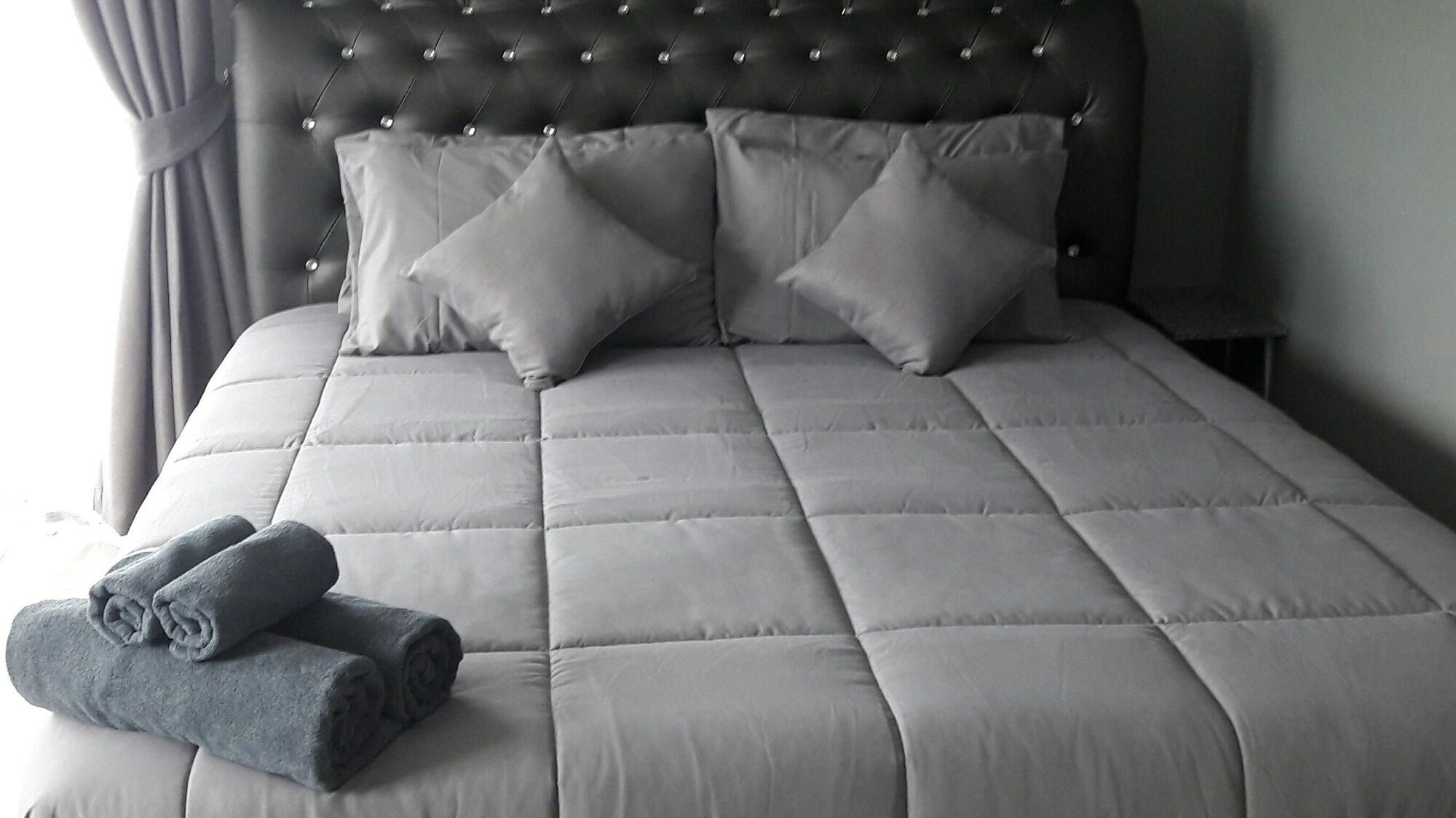 Habitación Asia's Beach Apartments