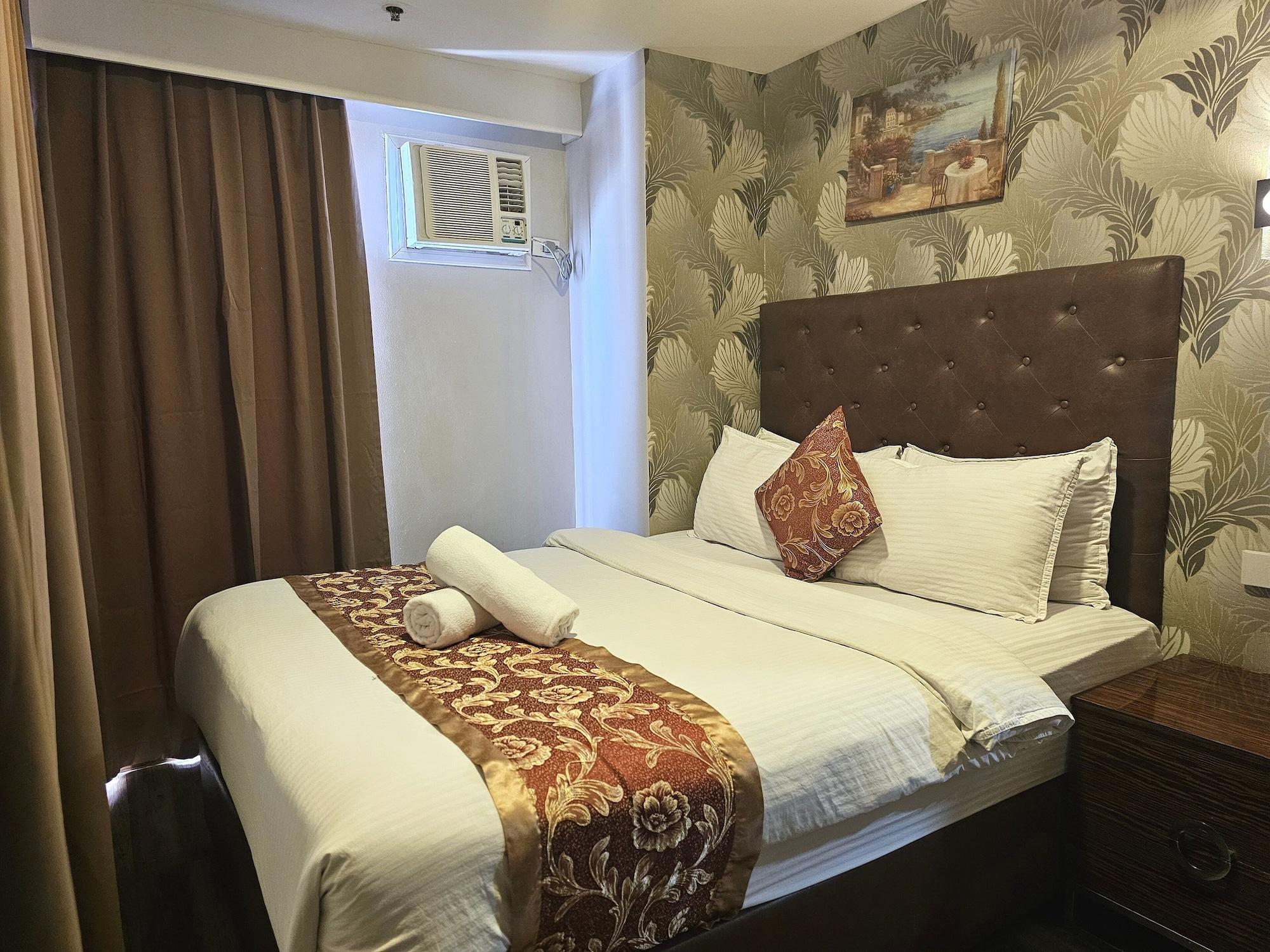 Habitación JMM Grand Suites