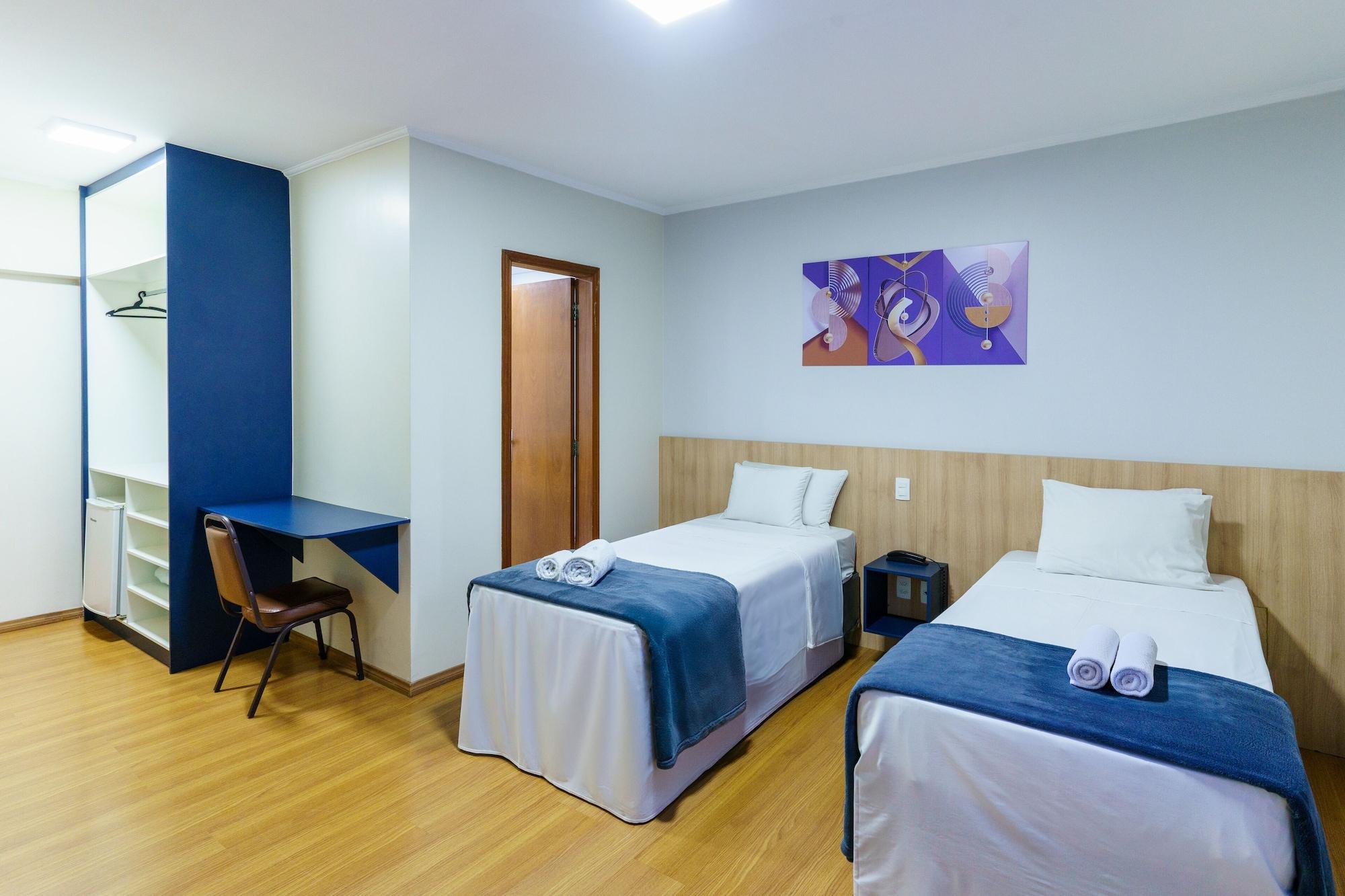 Quarto Carillon Plaza Hotel