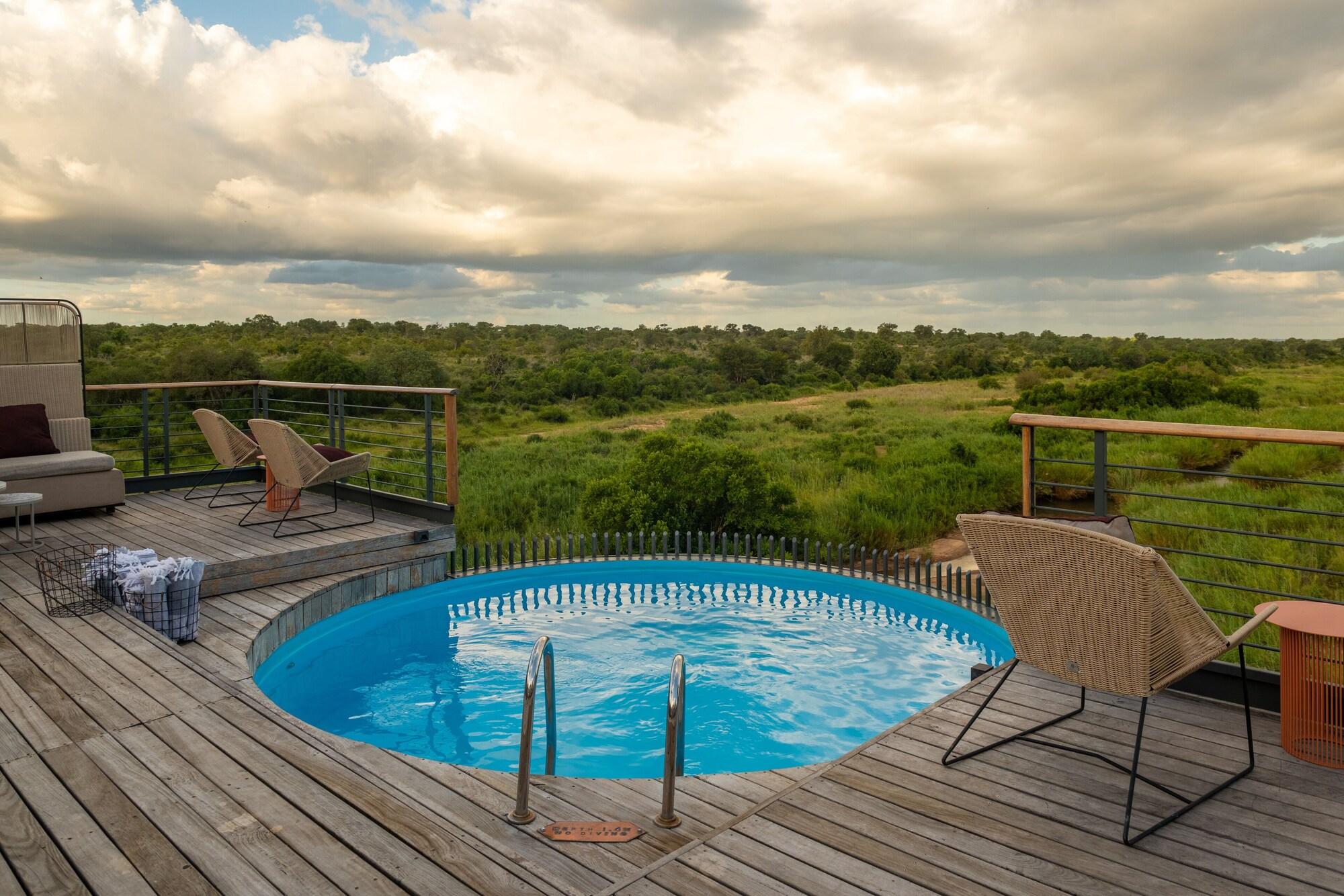 Vista Exterior Kruger Shalati - Train on the Bridge and Garden Suites