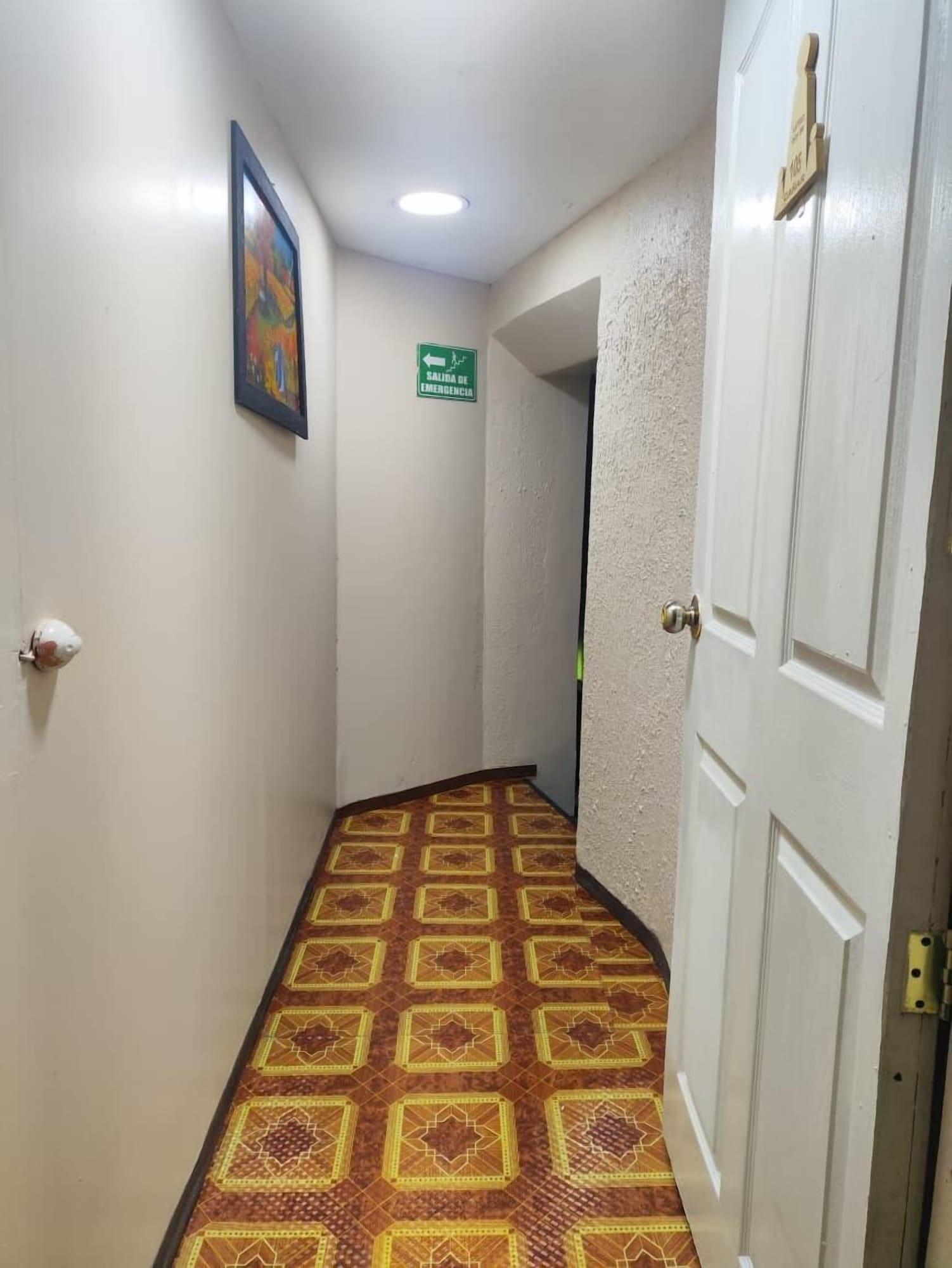 Habitación Hostal Latitud Ecuem