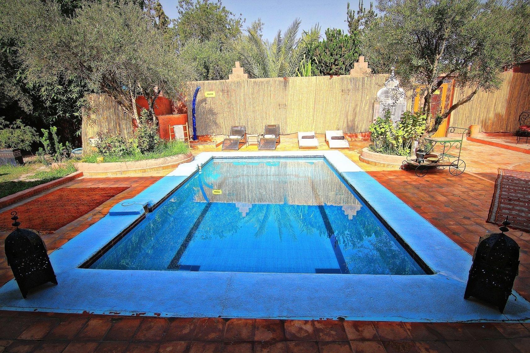 Vista Piscina Palm Auberge