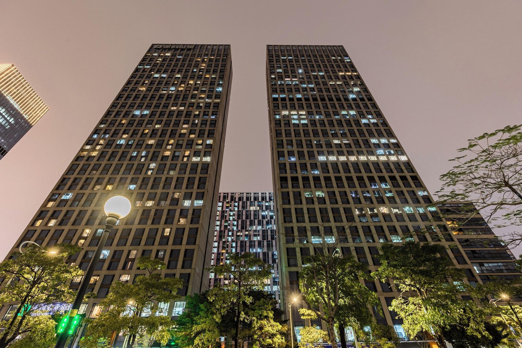 Vista Exterior Xingyi International Hotel Poly Store