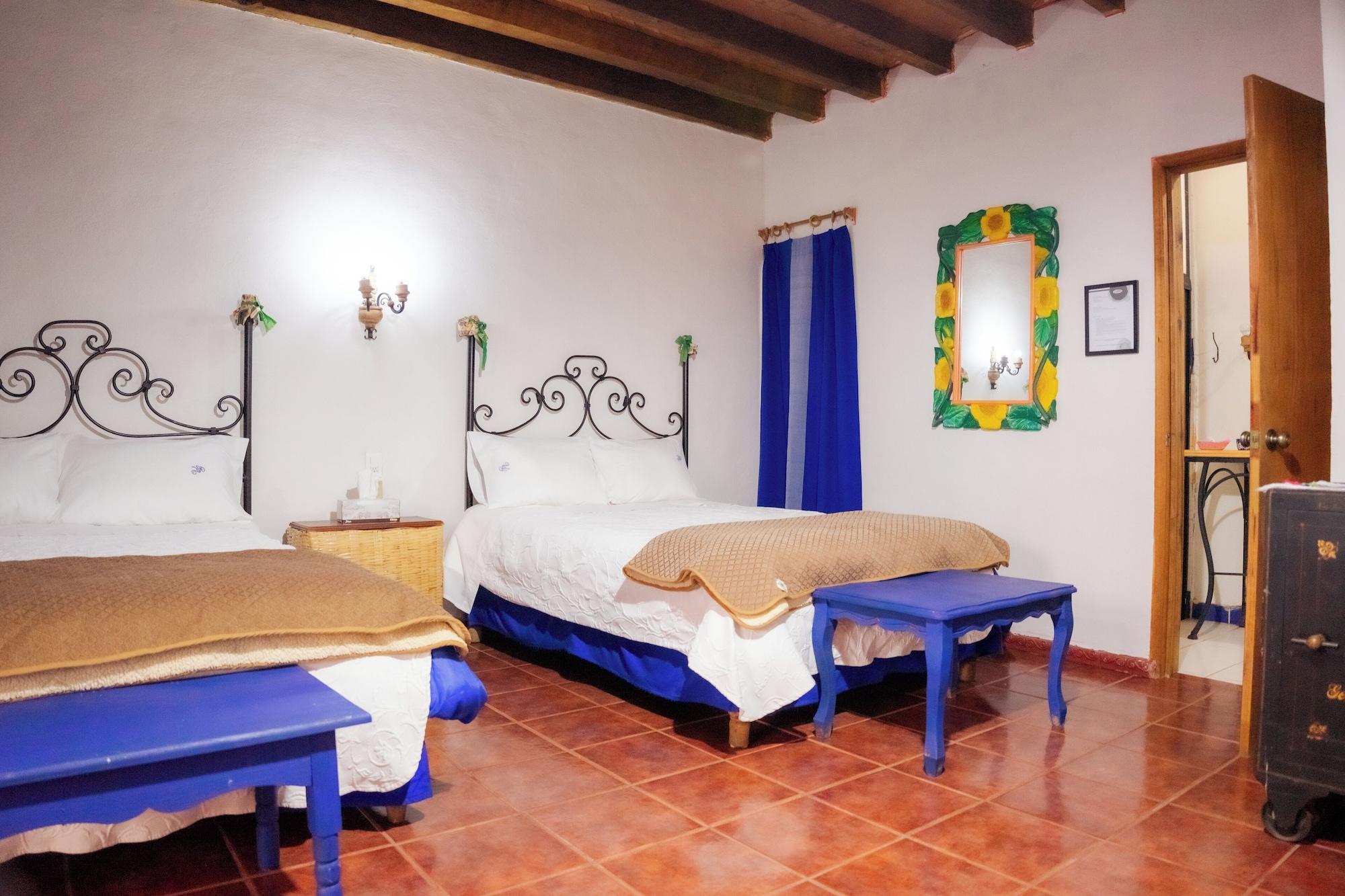 Habitación Hotel Villa Gardenias