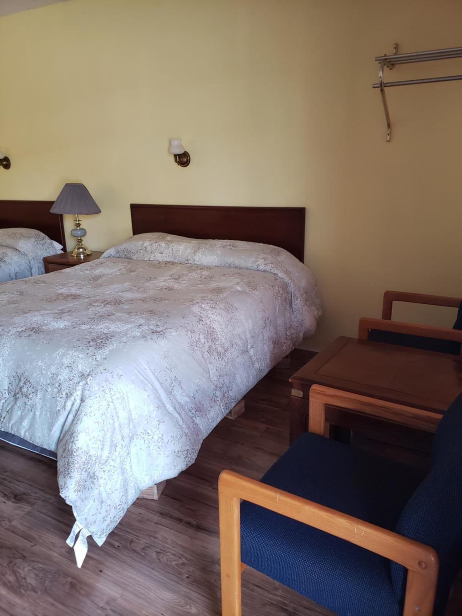 Habitación The Olympia Motel