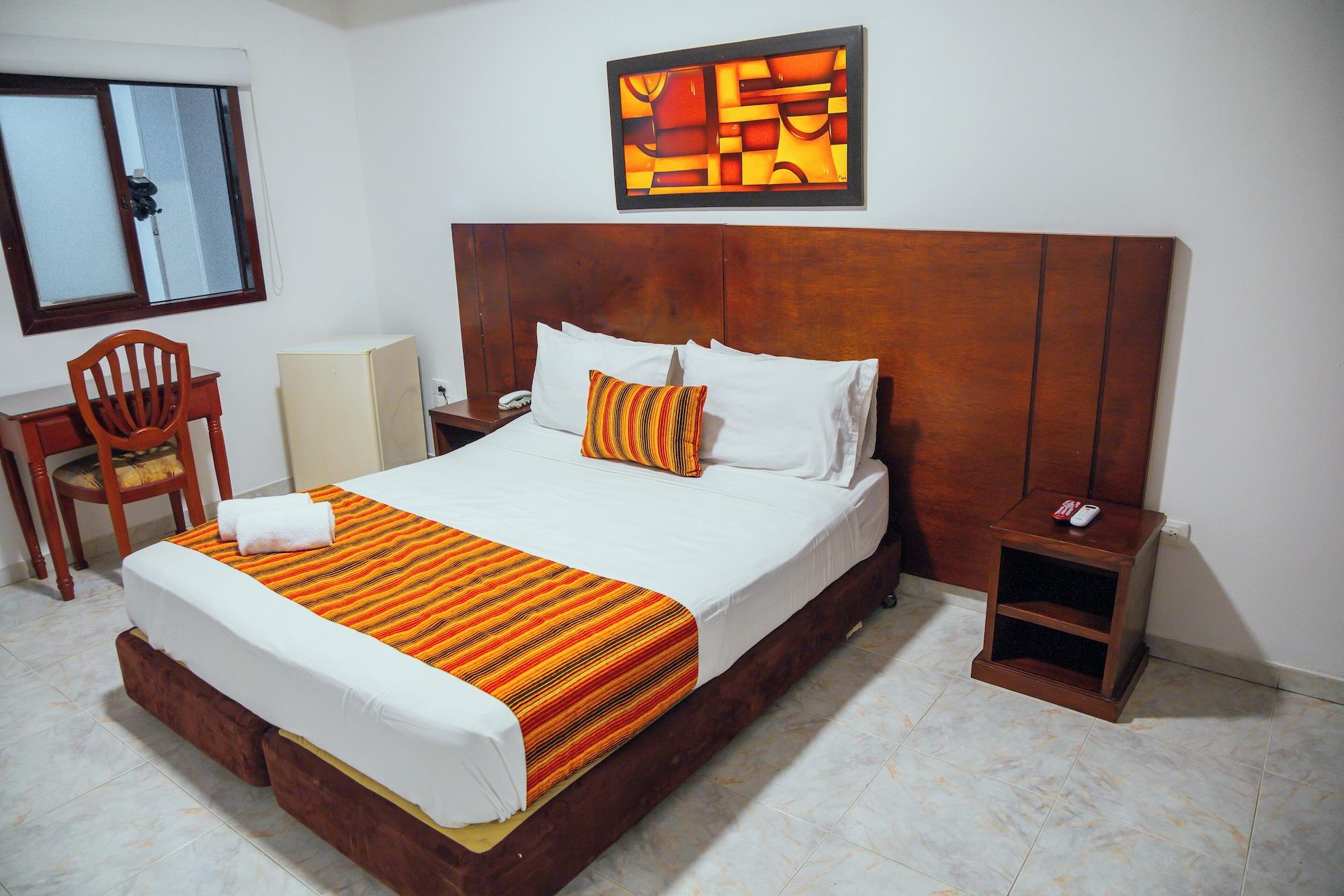 Habitación TAMA Hotel Granada Real Cali
