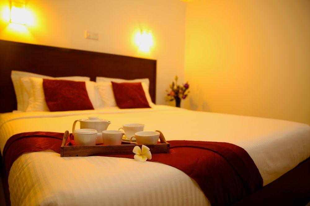 Habitación Whispering Palms Hotel