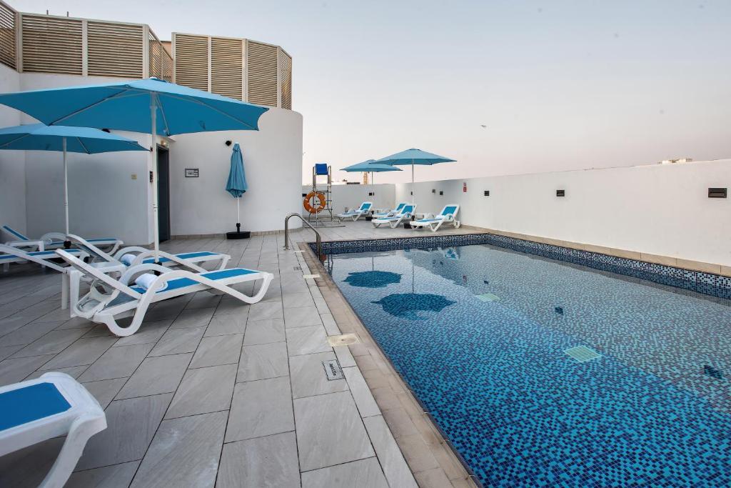 Vista Piscina City Avenue Al Reqqa Hotel